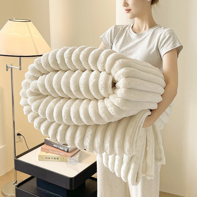 Ribbed throw blanket on bed